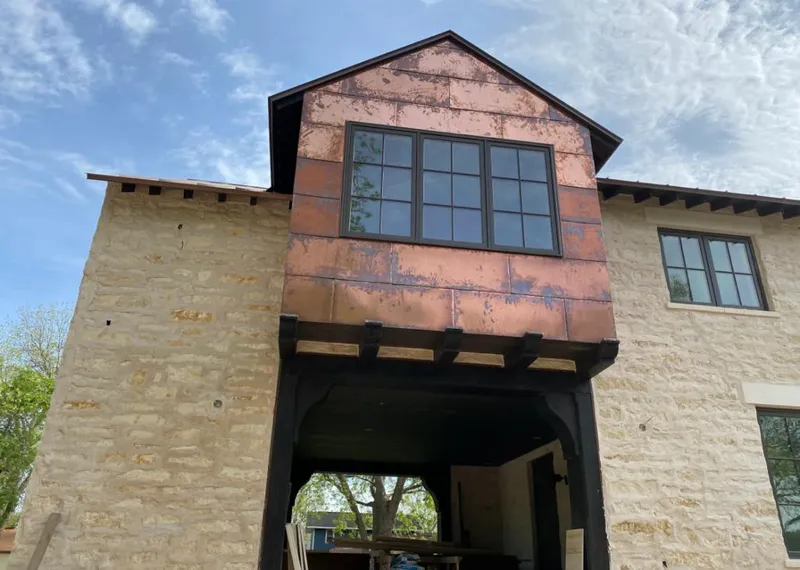 Copper metal panel facade on a stone building for Skylight Installation in Little Egg Harbor